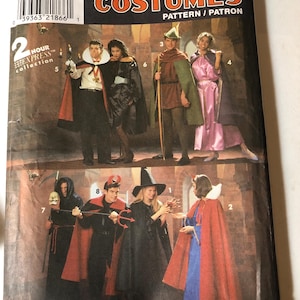 May include: A white ceramic mug with a black handle and the text "But First, Coffee" in a black, handwritten-style font. The mug is on a white surface.