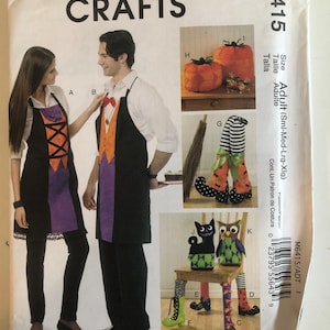 May include: McCall's Crafts sewing pattern M6415. The pattern includes instructions for making Halloween-themed aprons, pumpkin decorations, witch legs, and chair covers. The pattern is sized for adults.