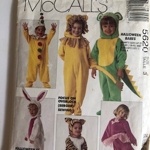 May include: A sewing pattern for Halloween costumes for babies and toddlers. The pattern includes costumes for a clown, lion, dinosaur, bunny, and tiger. The pattern also includes instructions for using an overlock (serger) sewing machine.