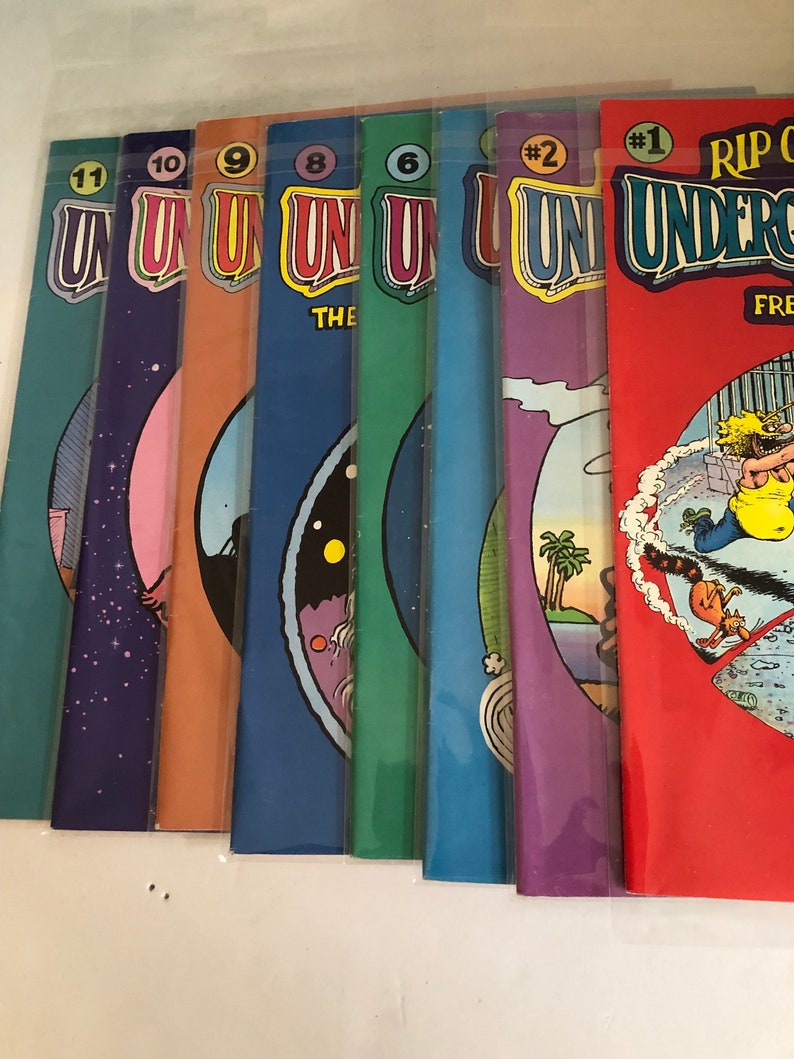 May include: A collection of eight comic books, all featuring the same title "Rip Off". The covers are colorful and feature various illustrations. The comic books are numbered 1 through 11, with the first comic book featuring the title "Rip Off Underground".