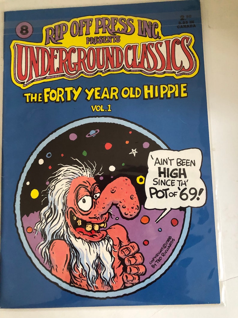 May include: A comic book cover featuring a cartoon of a long-haired, long-nosed man with a large grin. The title of the comic is "The Forty Year Old Hippie" and the text "Ain't Been High Since The Pot of '69!" is in a speech bubble above the man's head.