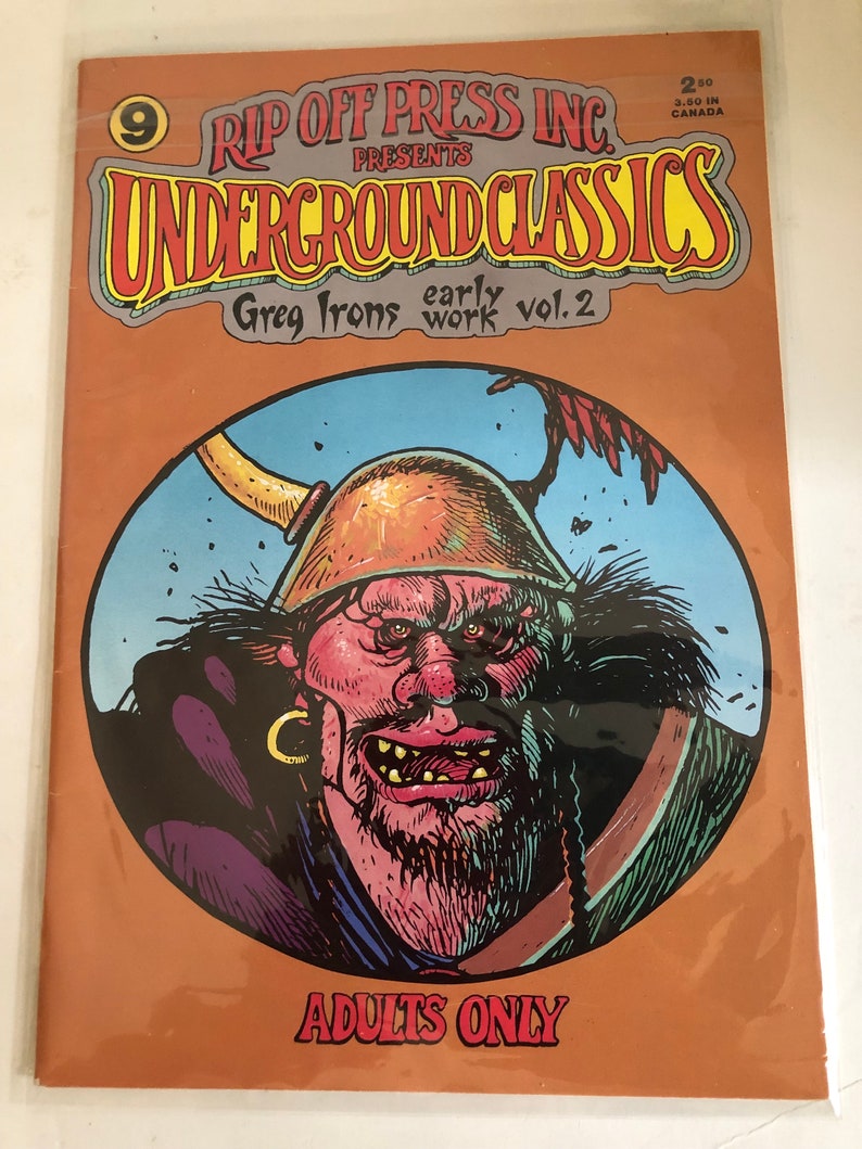 May include: A comic book cover featuring a cartoon illustration of a large, red-skinned, bearded man with a horned helmet. The comic book is titled "Underground Classics" and features the text "Greg Irons early work vol. 2". The cover is orange and has the text "Adults Only" at the bottom.