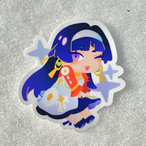 May include: A sticker featuring a cartoon character with long blue hair, wearing a white and red dress with a blue sash. The character has a pink and purple face with a winking eye and a tongue sticking out. The background is white with blue stars.