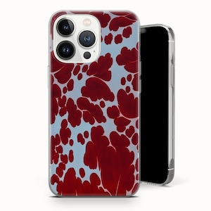 May include: A clear phone case with a red floral pattern on a light blue background. The case is shown with a black smartphone. The case has a camera cutout and buttons.