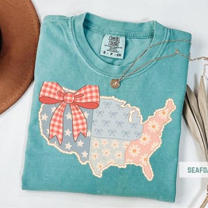 a t - shirt with a map of the united states on it