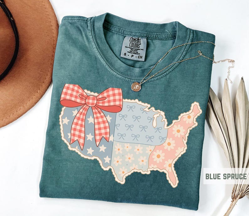 a t - shirt with a map of the united states with a bow on it