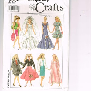 May include: A Simplicity Crafts sewing pattern, number 9334, featuring illustrations of various women's dresses and outfits. The pattern includes a wedding dress, a long blue gown, and other stylish ensembles. The package is white with black text.