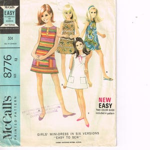 May include: Vintage McCall's sewing pattern for girls' mini-dresses, size 12. The pattern cover features illustrations of four girls in different mini-dress designs. The text reads "Easy to Sew."