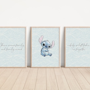 May include: Three blue and white framed prints with a blue cartoon character and text. The text on the prints reads "Ohana means family, and family means nobody is left behind or forgotten."