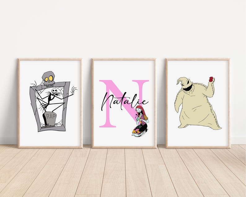 May include: Three framed prints featuring characters from the Nightmare Before Christmas. The first print shows Jack Skellington standing on a tombstone. The second print shows the letter N in pink with the name Natalie written in black. The third print shows the character Oogie Boogie holding a red heart.