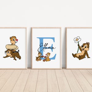 May include: Three framed prints featuring a cartoon chipmunk character. The first print shows the chipmunk riding on another chipmunk's back. The second print shows the chipmunk holding a flower. The third print shows the letter E with the name Ethan written below it.