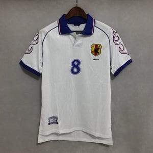 Japan 1998 jersey
Retro Japan shirt
Vintage Japan kit
Samurai Blue 1998
Japan World Cup 98
Classic Japan shirt
Japan away jersey 98
Japan football shirt
Flame design jersey
JFA 1998 kit
Retro soccer top
World Cup Japan shirt
Japan national team kit