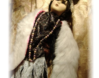 A Boudoir Doll In Black, Silver And Fur