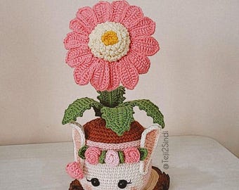 Pattern and tutorial in Spanish for a potted gerbera, crocheted flowers in a bunny pot, amigurumi flower and pot