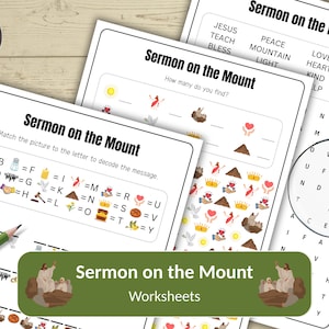 May include: A collection of "Sermon on the Mount" worksheets, including a word search, a matching activity, and a "how many do you find?" exercise. The worksheets are printed on white paper with black text and colorful illustrations. A green pencil is visible.