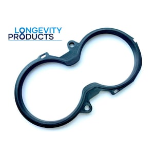 May include: A black plastic 3D printed part with two circular openings. The part is designed to fit around two round objects.