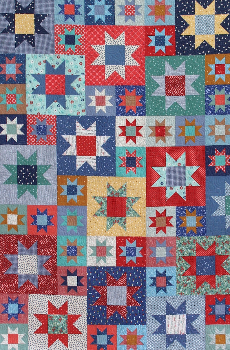 May include: A patchwork quilt with a repeating pattern of red, blue, and yellow stars. The quilt is made up of various fabrics with different patterns, including floral, polka dot, and geometric designs.
