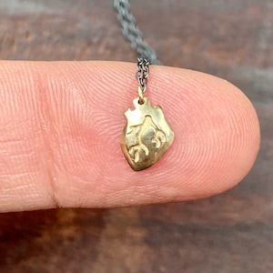 Tiny Anatomical Heart Charm Necklace, 14k yellow gold miniature heart charm on oxidized silver chain