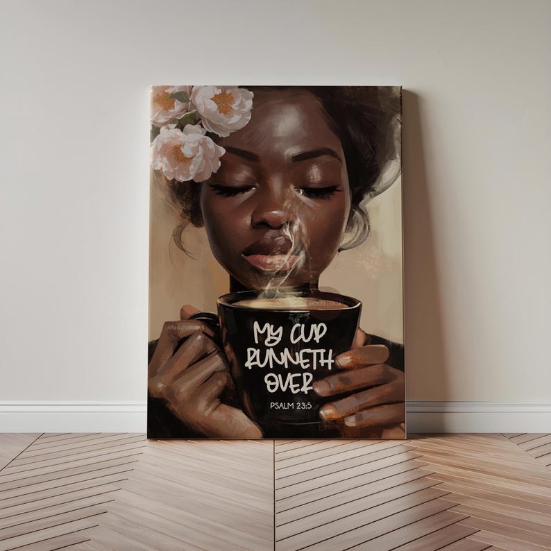 May include: A canvas print depicts a Black woman with closed eyes, adorned with flowers, holding a steaming black coffee mug. The mug features the text "My cup runneth over" and Psalm 23:5.