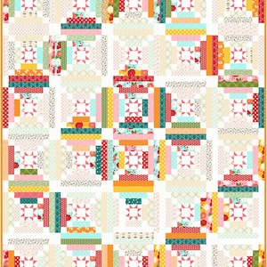 May include: A colorful quilt with a patchwork design. The quilt features squares with star-shaped centers and is surrounded by a border. The squares are made of various fabrics in shades of pink, teal, orange, and green.