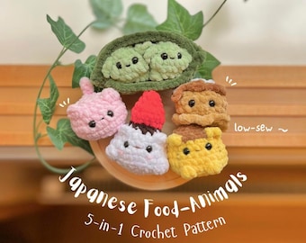 May include: A selection of five crocheted Japanese food-animal amigurumi. The set features a pink cat, a white dessert with a red topping, a yellow and brown dessert, and two green peas in a pod. The text "Japanese Food-Animals" and "5-in-1 Crochet Pattern" are visible.