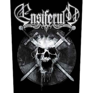 May include: Black and white graphic featuring the band name "Ensiferum" in a stylized font. A skull with smoke rising from it is centered, with two crossed swords behind it. The design is set against a black background.