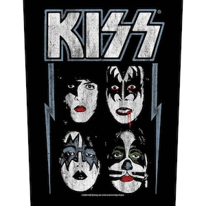 May include: A black and white patch featuring the word "KISS" in a vintage style font. Beneath the word are four black and white images of the band members' faces with makeup. The text "©2020 KISS Catalog, Ltd. Under License to Epic Rights." is at the bottom.