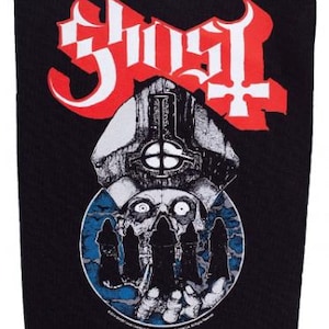 May include: Black patch with the band name "Ghost" in red and white gothic lettering. The patch features a detailed illustration of a skull, a papal mitre, and figures in a blue and white circular design.