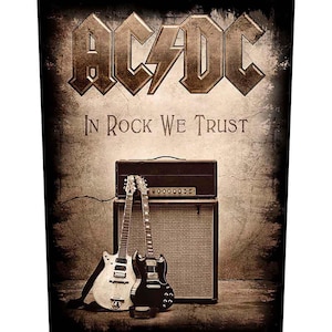 May include: A sepia-toned image featuring the band name "AC/DC" in a bold, stylized font above the phrase "In Rock We Trust." Two electric guitars lean against an amplifier and speaker cabinet. The overall aesthetic is vintage and rock-themed.