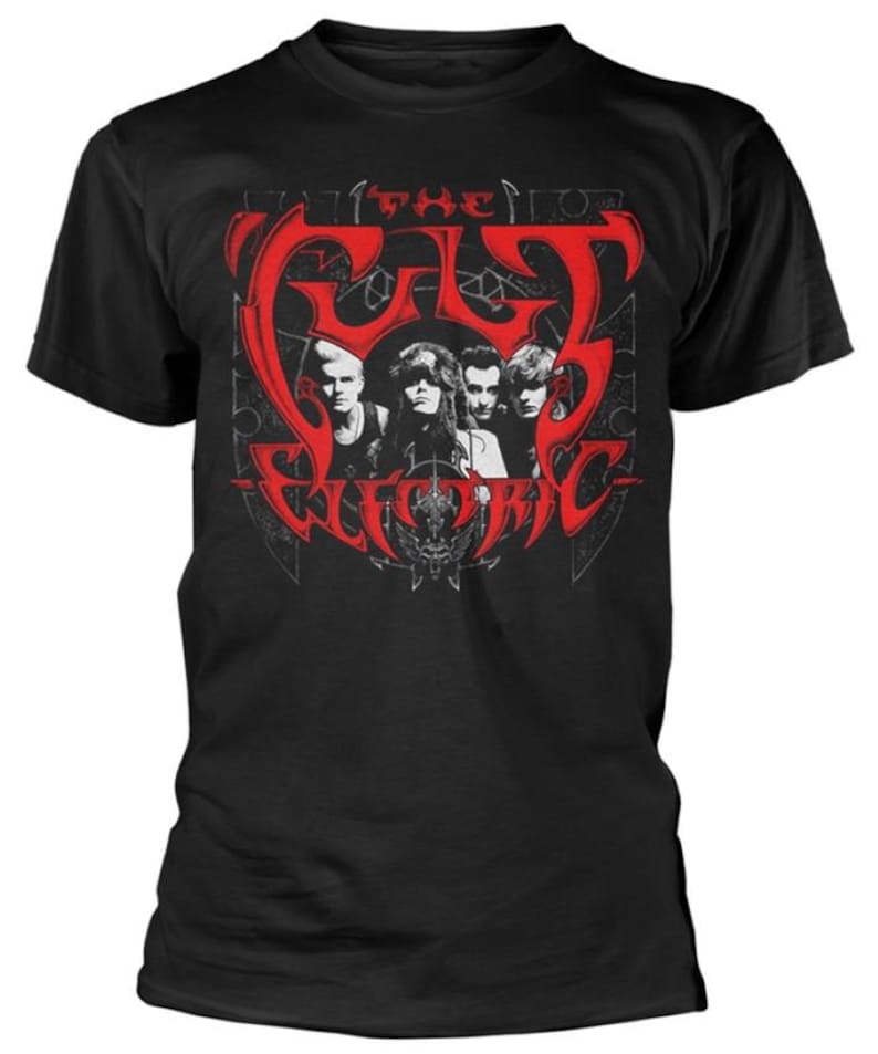 May include: Black t-shirt featuring a red graphic of the band "The Cult" with the words "The Electric" below. The graphic includes a stylized image of the band members. The shirt is a crew neck style.