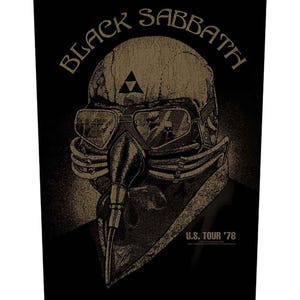 May include: Black Sabbath U.S. Tour '78 poster. The design features a skull wearing goggles and a respirator, with the band's name arched above. The image is in shades of brown and black, with a triangle symbol above the goggles.