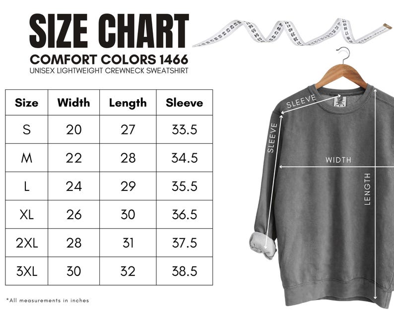 Puede incluir: Una sudadera gris unisex de cuello redondo y ligera colgada de una percha de madera. La imagen incluye una tabla de tallas con medidas en pulgadas para el ancho, el largo y el largo de la manga, desde la talla S hasta la 3XL.