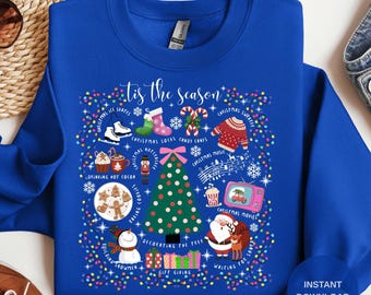 May include: Royal blue sweatshirt with a festive Christmas design. The graphic includes a Christmas tree, Santa Claus, and various holiday icons like ice skates, candy canes, and a Christmas sweater. Text reads "'tis the season."