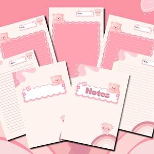 May include: A collection of pink and white stationery featuring a cute bear theme. The stationery includes lined and blank pages, with decorative elements like scalloped edges, floral accents, and the word "Notes". The overall design is soft and playful.