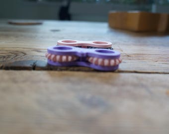 The Sensory Stim Gear Roller Fidget Keyring attachment.