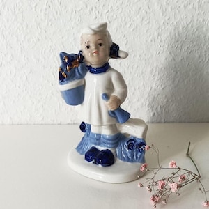 Vintage Dutch Girl Figurine: Hand-Painted Blue & White Ceramic Decor