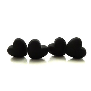 May include: Three black heart-shaped silicone beads.