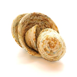 May include: Three woven bowls, nested together, with a brown, yellow, and white pattern. The bowls are made of fabric and have a unique, handmade look.