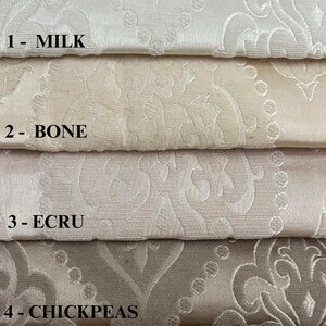 Puede incluir: Cuatro muestras de tela en diferentes tonos de blanco y beige. Las muestras est&aacute;n etiquetadas como 1- Leche, 2- Hueso, 3- Crudo y 4- Garbanzos.
