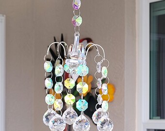 Chandelier like suncatcher with a big prism and 6 arms holding a set of octagons, will reflect the light in any place in your house,