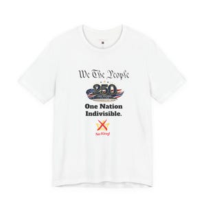 May include: A white short-sleeve t-shirt featuring the text We The People, a 250 years Independence Day 2026 graphic with an American flag motif, the text One Nation Indivisible, and a yellow crown graphic with a red X and the text No King!