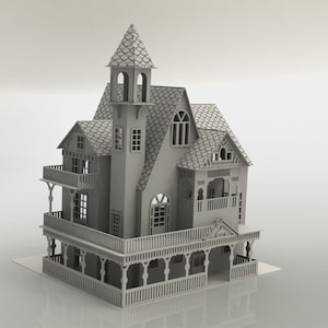 May include: A detailed, gray miniature house with a tower, balconies, and intricate architectural details. The house features multiple windows, a shingled roof, and a porch with decorative railings. The overall design suggests a Victorian or similar style.