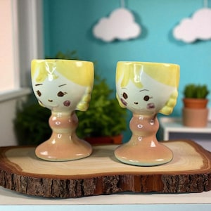 Vintage Mid-Century Girl Face Egg Cups – Hand-Painted Ceramic – c. 1950s–1970s (Pair)