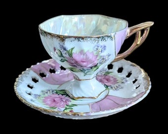 Vintage Japanese Porcelain Teacup and Saucer with cut out details and gold gilt. 1921-1946