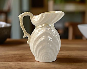 Vintage Belleek Irish Porcelain Shell Creamer – 4.5" Tall – Sea Shell Design with Coral Handle – Green 6th Mark (1965–1980)