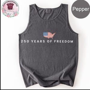 A gray tank top with the text "250 YEARS OF FREEDOM" printed on it, along with an American flag design.