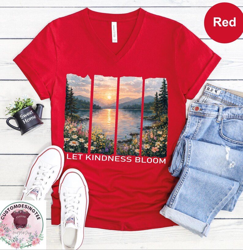 a red t-shirt with a scenic landscape design, a pair of jeans, a pair of white sneakers, and a small potted plant.