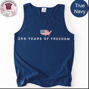 A navy blue tank top with the text "250 YEARS OF FREEDOM" printed on it, along with an American flag design.