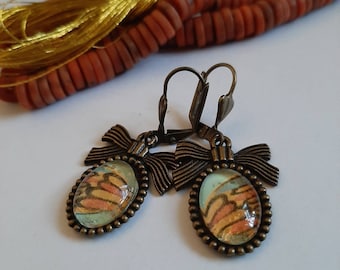 Butterflu Effekt Glas Cabochon Ohrringe auf Messing