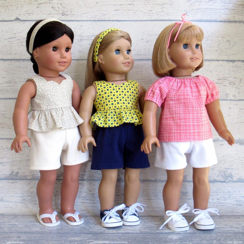 Multiple summer outfits for 18 inch dolls.  Each set includes a shirt, shorts, and hair accessory.  You choose from nine different sets.